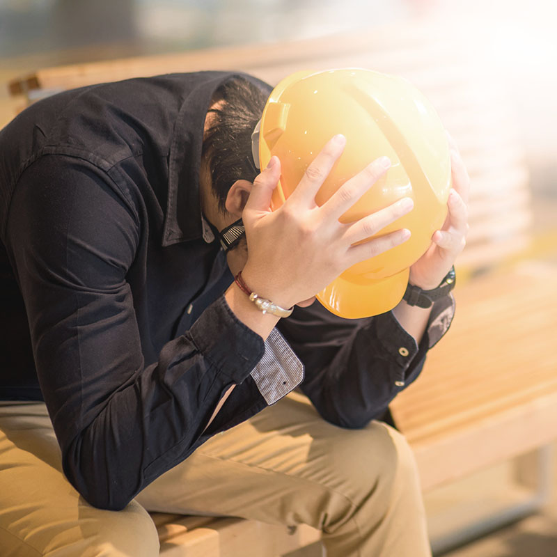 WLA_Man in hardhat looking down